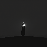 A cloaked figure stands on a hilltop at night, holding a glowing light in their hands, symbolizing the potential for individuals to change the world wisely.