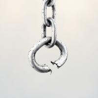 A close-up of a silver chain link, visibly cracked and weakened, symbolizes the idea that a single weak link can make for an easier chain to break. The background is softly blurred.