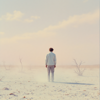 A solitary figure stands in a desolate landscape, surrounded by barren earth and mist, evoking the poignant quote: The man was gone and there was no one left to see him die. 