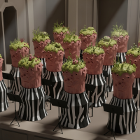 Alien, fleshy pillars with pink-brown skin, topped with sensor-studded protuberances and off-colored moss, draped in black-and-white fabrics, arranged like an orchestra.