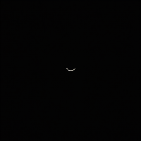 A minimalist image featuring a faint, curved line against a solid black background, symbolizing the quote, The darkness is not my enemy; it is my friend.