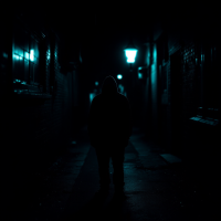 A shadowy figure stands in a dimly lit alley, illuminated by faint blue lights, embodying the complexity of justice that often eludes the innocent.