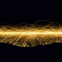 An expansive, dark sky illuminated by countless threads of golden light, crackling and flickering like heatless lightning, creating a mesmerizing display from horizon to horizon.
