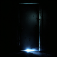 A partially open door in a dimly lit space, with a faint light spilling in from the darkness, evokes the hidden stories and fears behind closed doors.