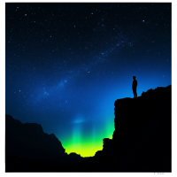 A silhouette of a person standing on a cliff under a starry sky, illuminated by vibrant green and blue hues, embodying the quote, There is nothing to be afraid of in the universe but fear itself.